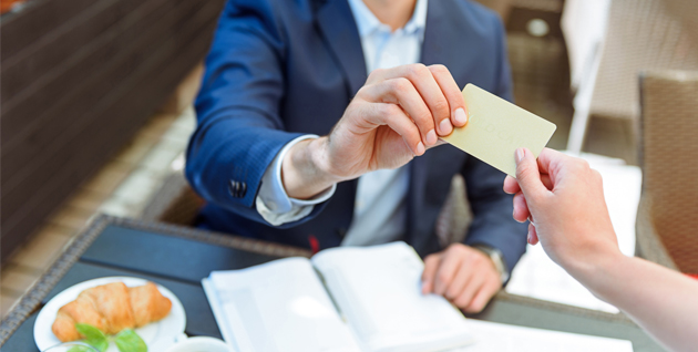 Man handing off card