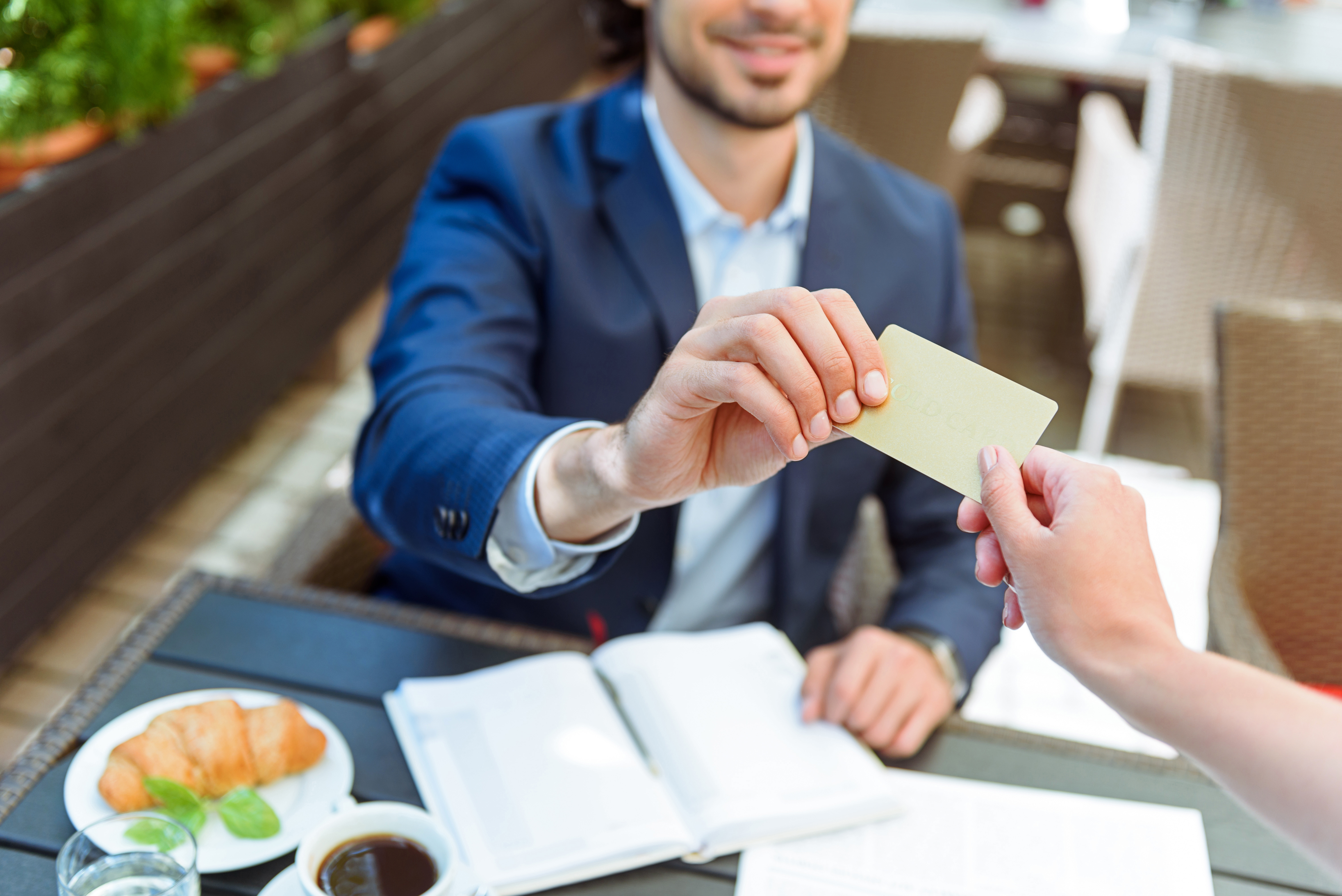 Man paying by credit card at a restaurant