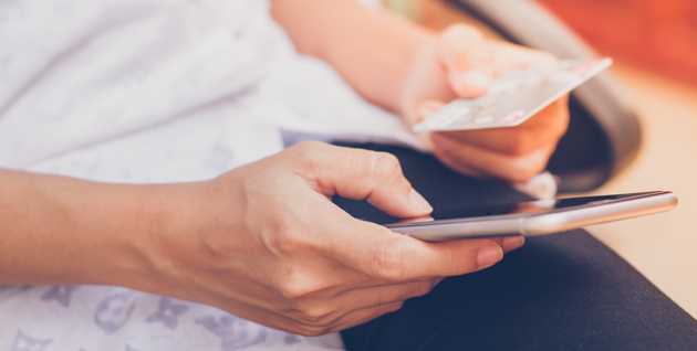 Women holding phone and card